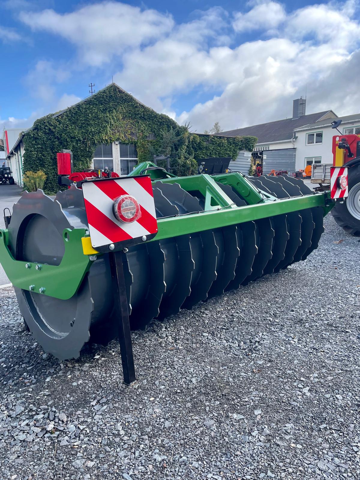 landscape rake, disc harrow, green frame, metal discs, agricultural implement