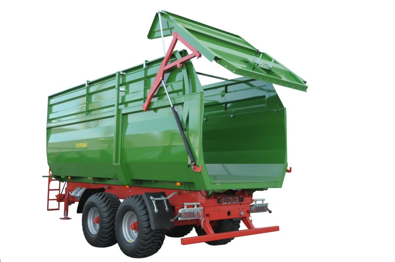 grune landwirtschaftsballenentnahme, grünes landwirtschaftliches fahrzeug, landwirtschaftlicher anhänger, mulde, schwenkdach-anhänger